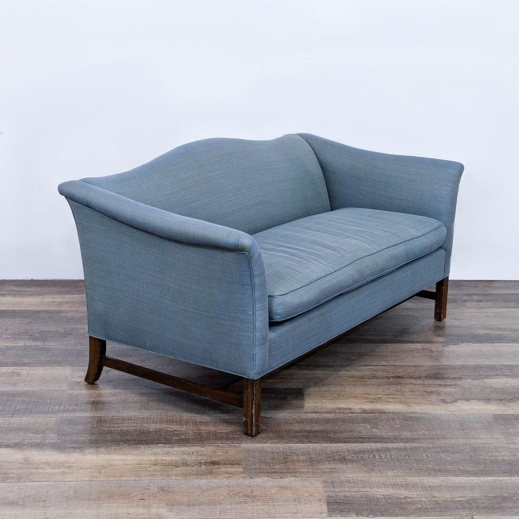 a pair of french blue and grey sofas