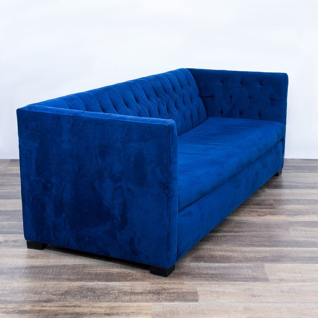 the [ unused0 ] sofa in deep blue velvet