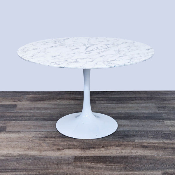 a white marble table with a white marble top.