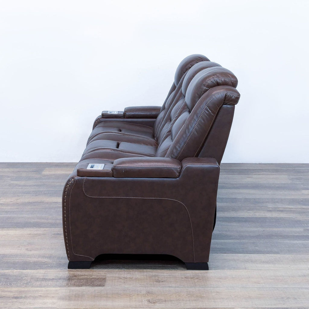 The Man-Den Triple Power Leather Reclining Sofa By Ashley Furniture