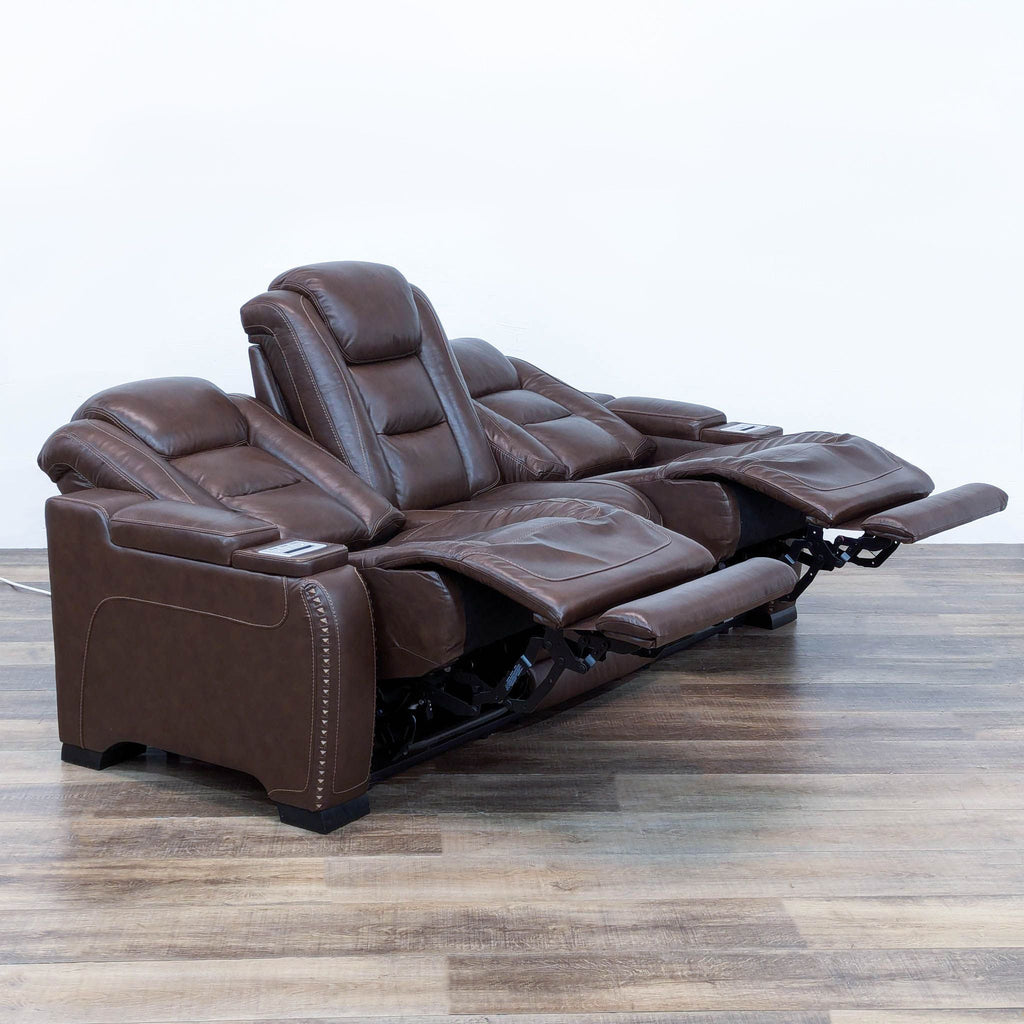 The Man-Den Triple Power Leather Reclining Sofa By Ashley Furniture