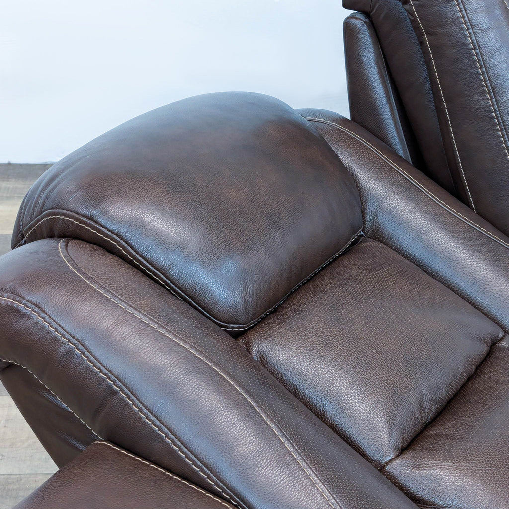 The Man-Den Triple Power Leather Reclining Sofa By Ashley Furniture