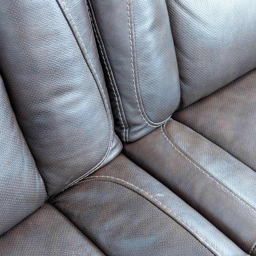 The Man-Den Triple Power Leather Reclining Sofa By Ashley Furniture