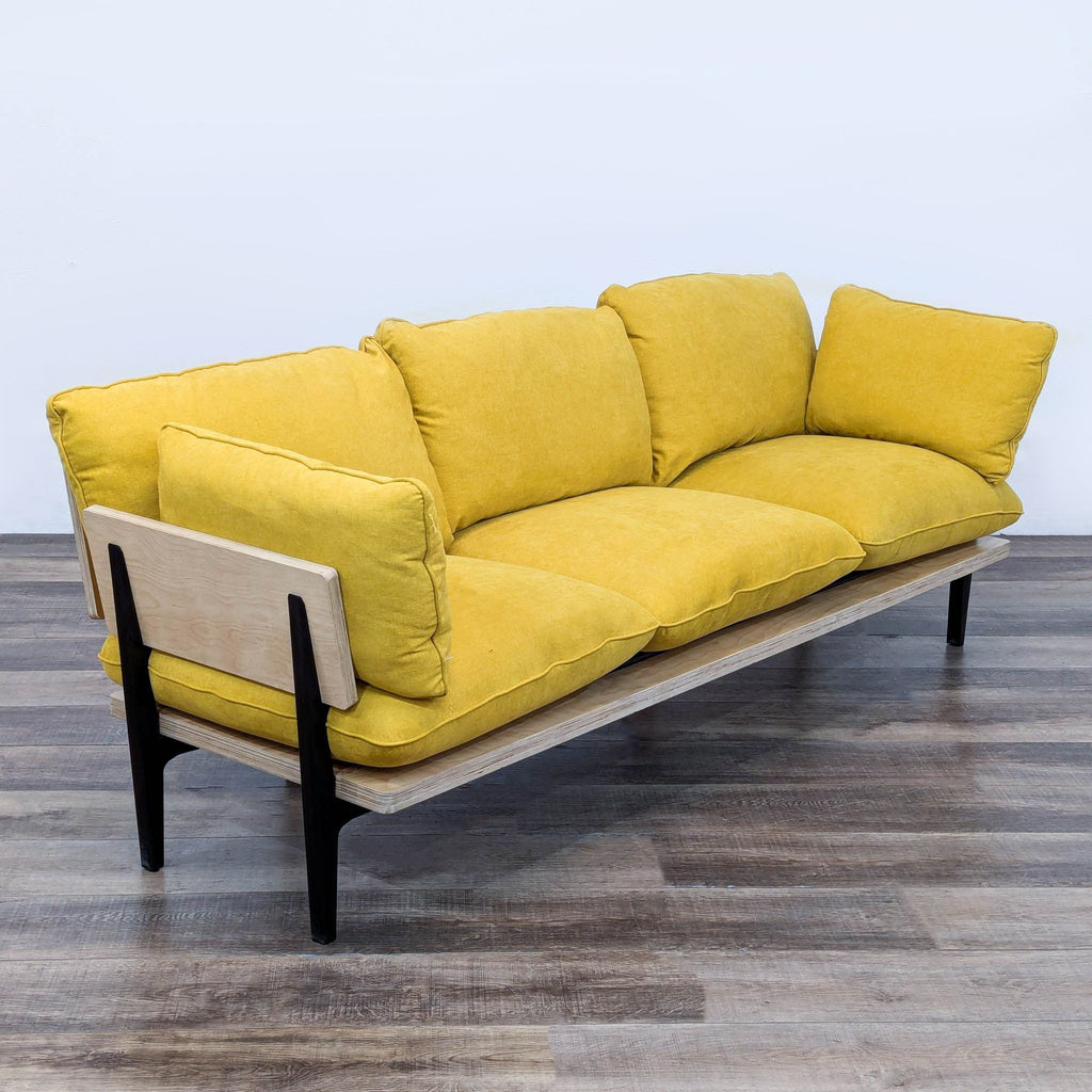 a yellow sofa by [ unused0 ]