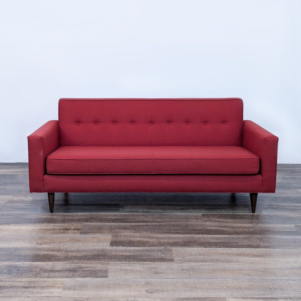 a red sofa in the style of [ unused0 ]