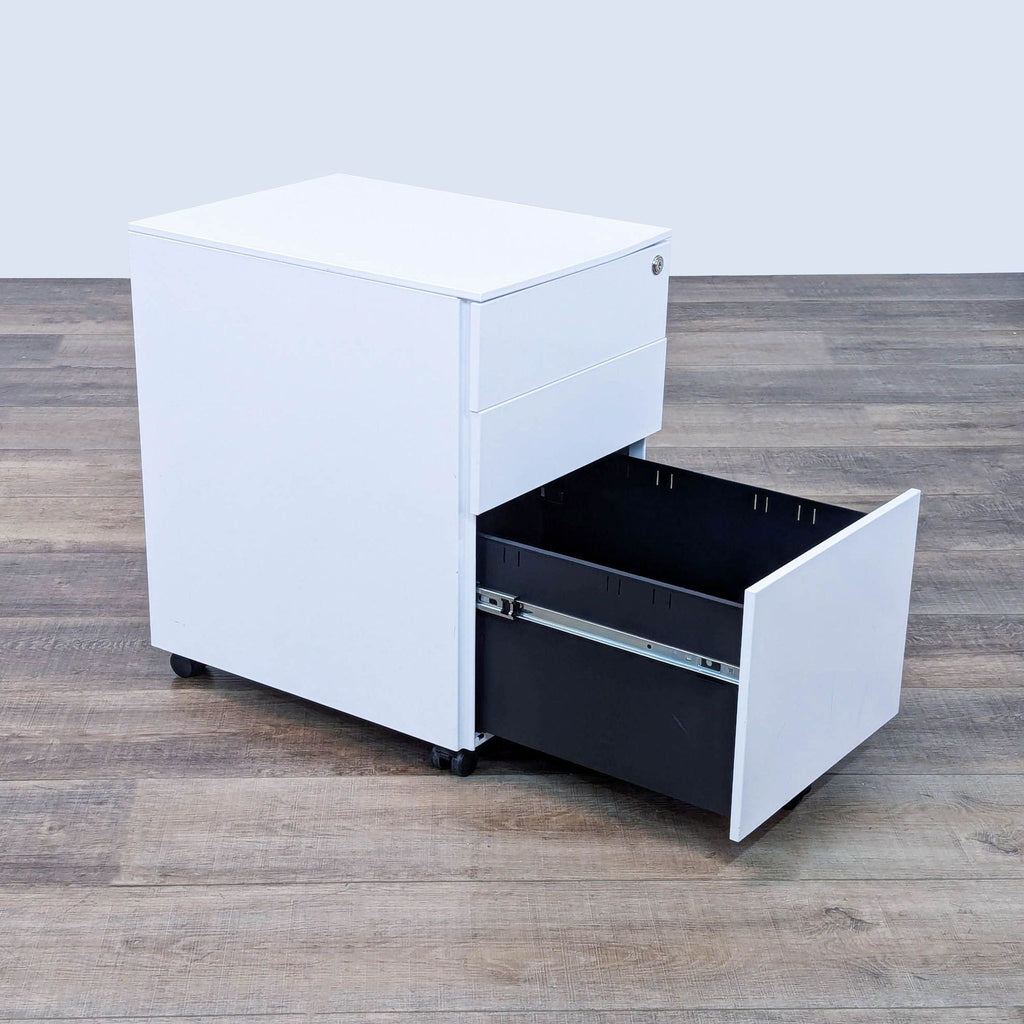 the white metal file cabinet with a black metal base