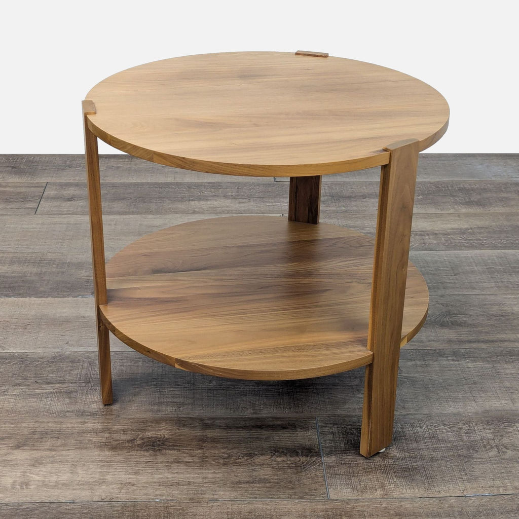 a round wood coffee table with a shelf