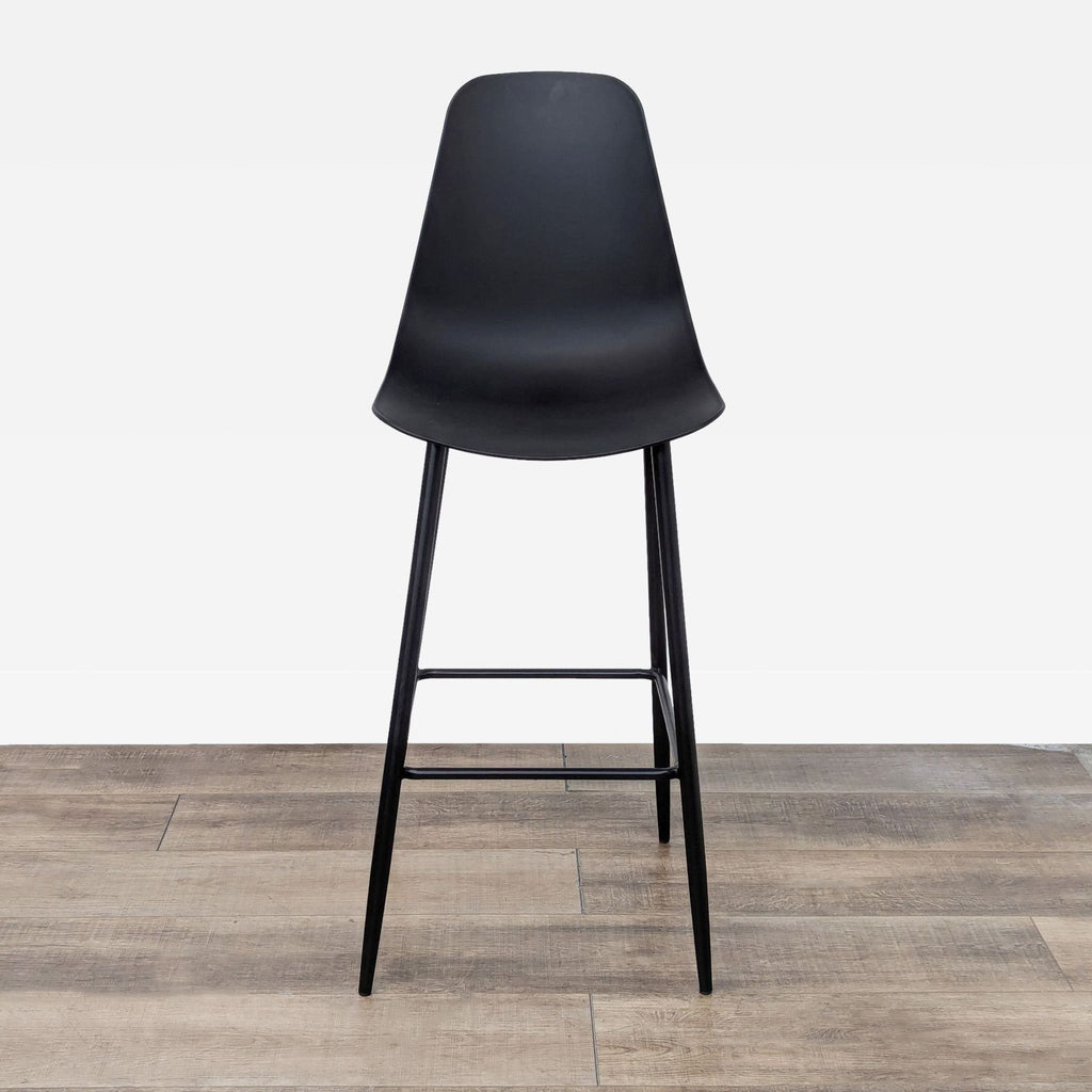 Sleek black stool featuring a molded plastic seat and a sturdy metal base.