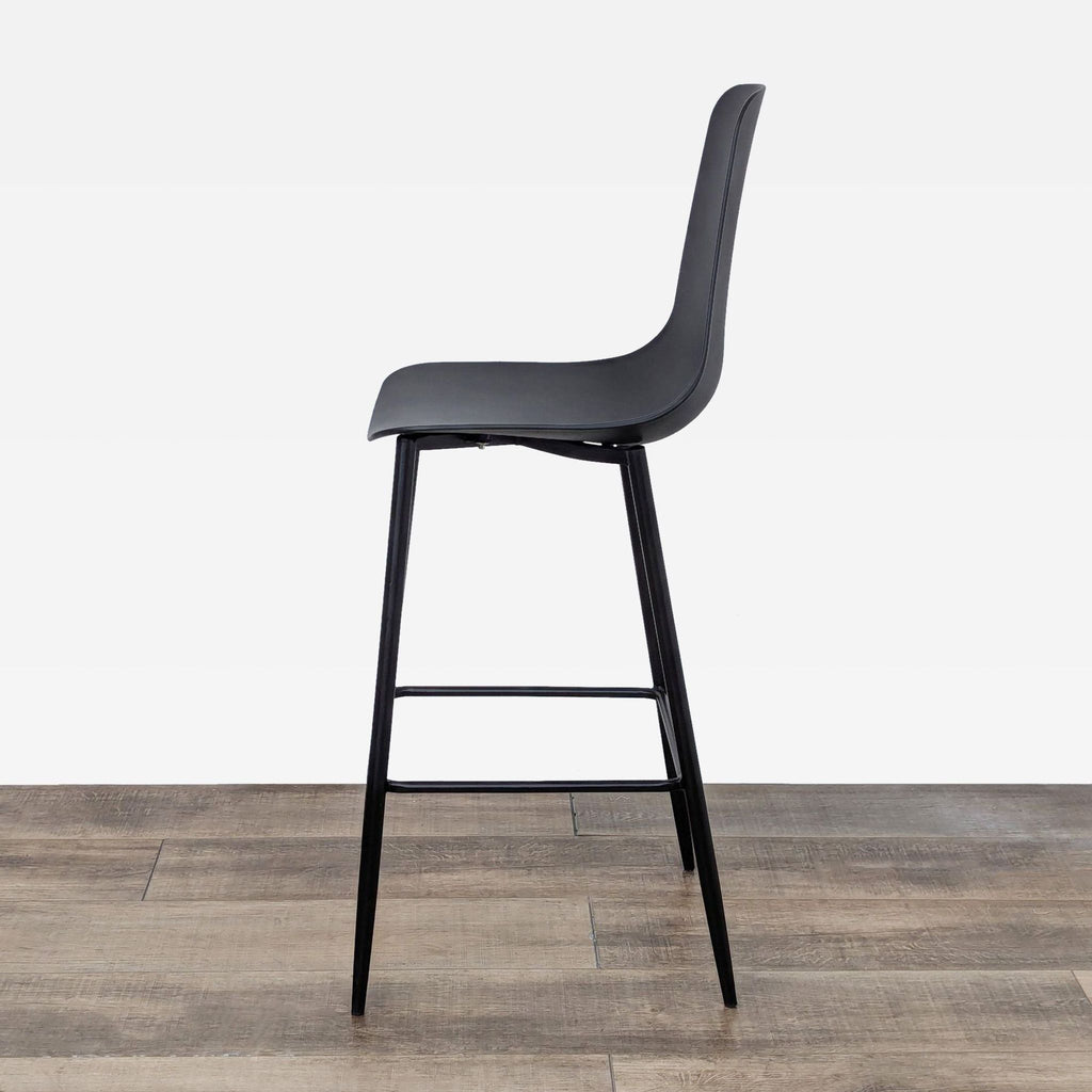 Contemporary high-back stool in black, with a minimalist metal frame and plastic seat.