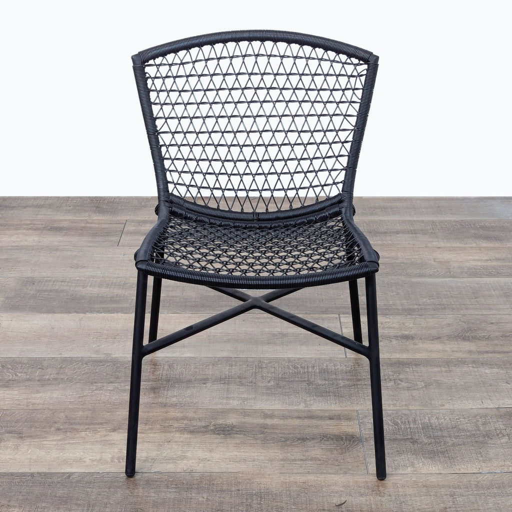 the black rattan chair is a modern take on the classic design.