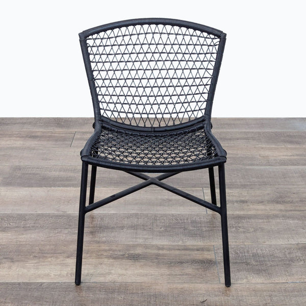 the black rattan chair is a modern take on the classic design.