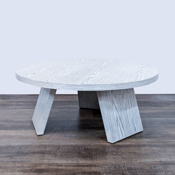 the coffee table is made from a solid wood and has a white finish.