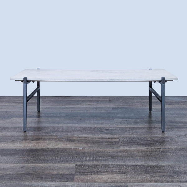 the [ unused0 ] table is made of a white marble top and a steel frame.