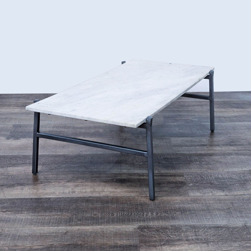 a marble coffee table with a white marble top.