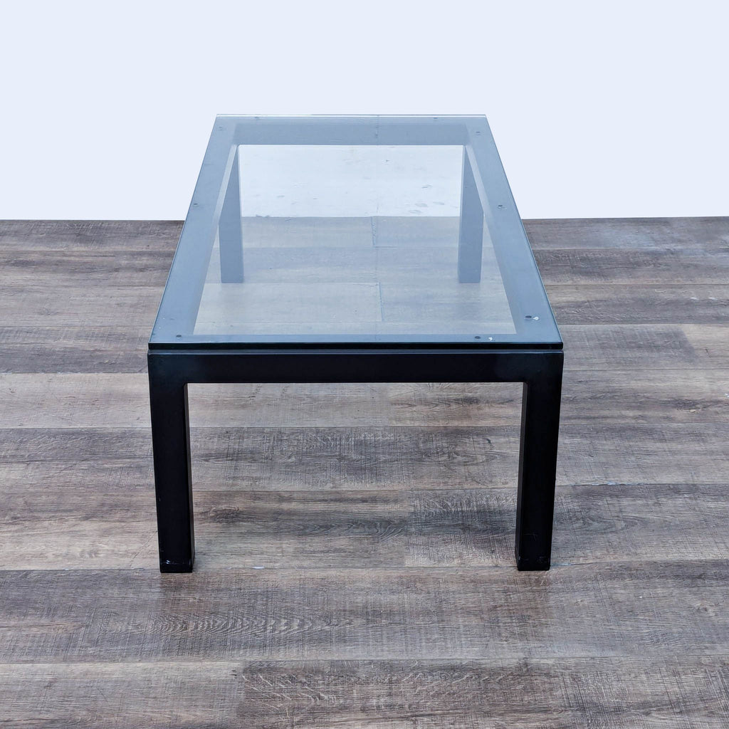 a mid century modern black glass coffee table