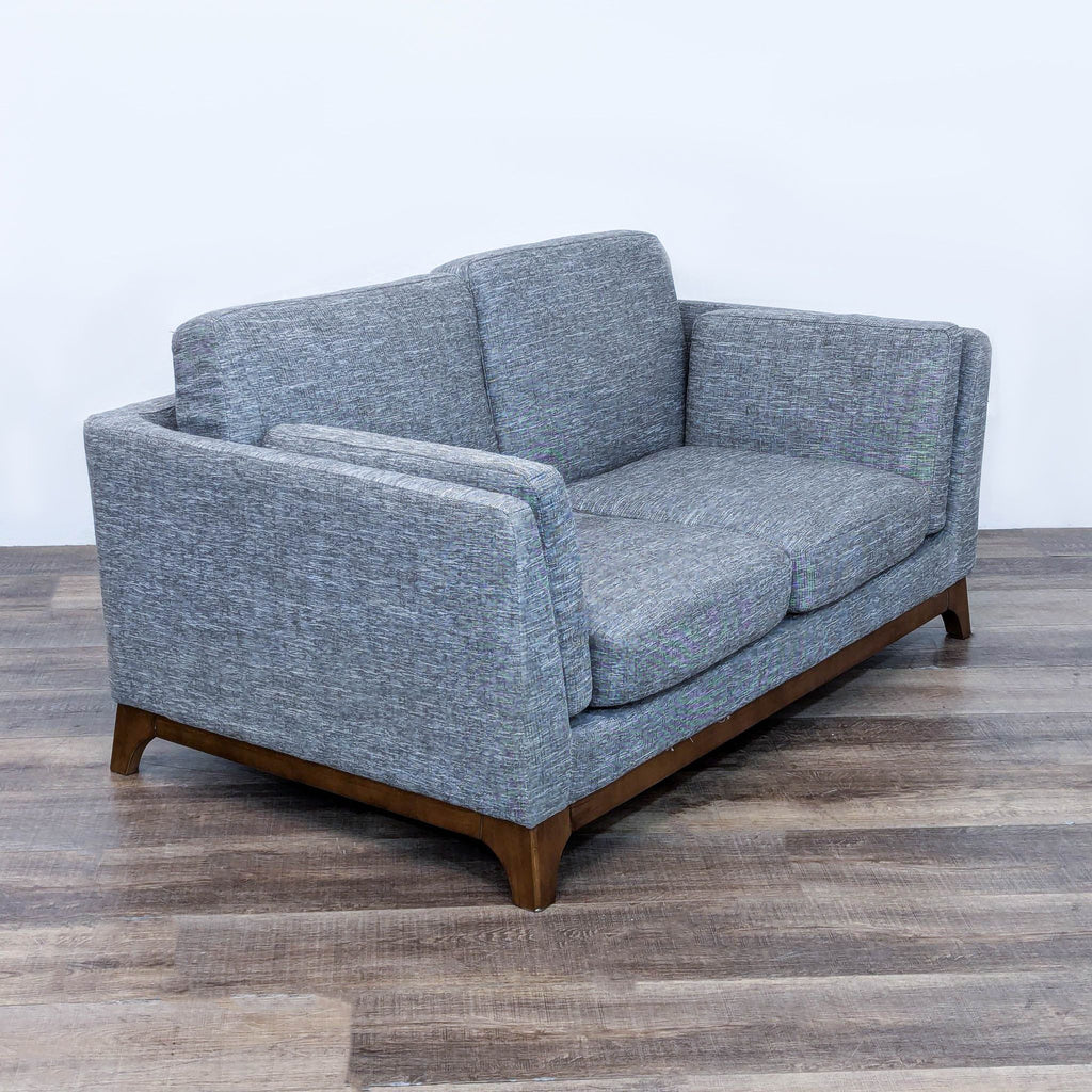 a pair of sofas in the style of [ unused0 ]