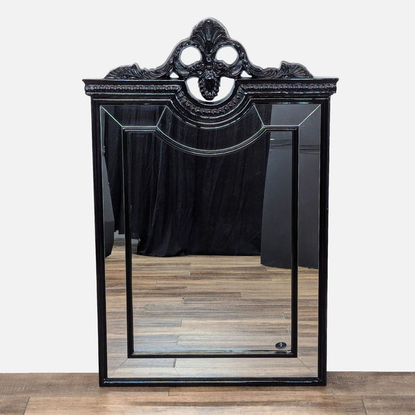 a gothic mirror with a gothic frame.