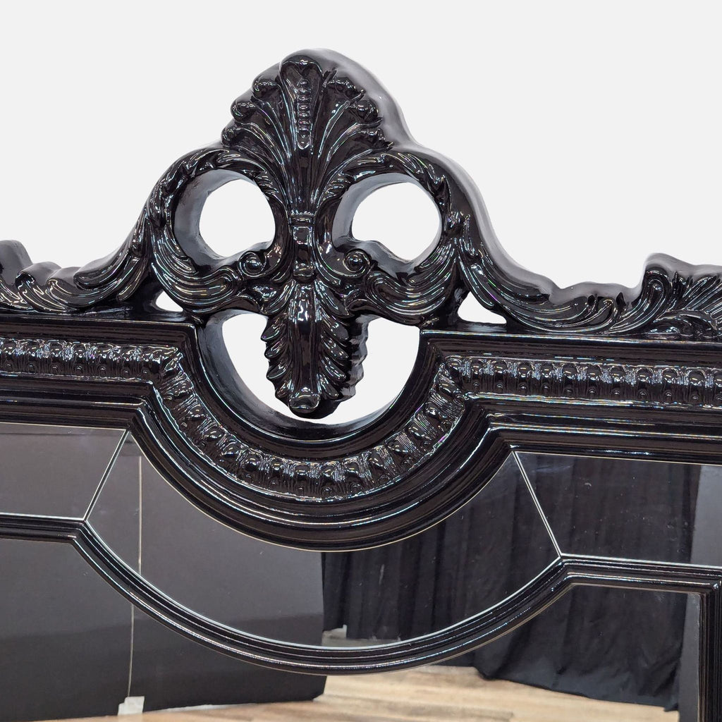 a gothic style carved black carved wood bed frame