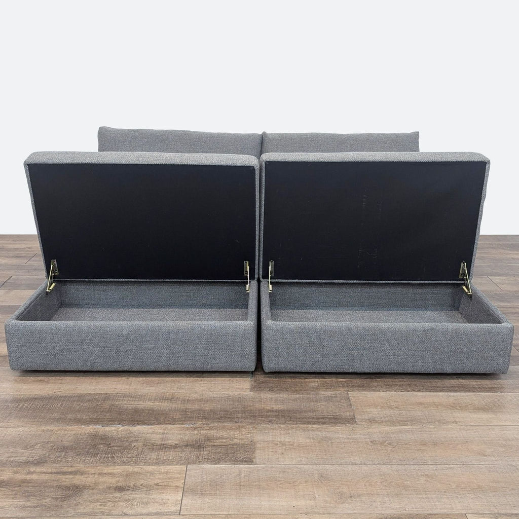 a pair of grey fabric sofas