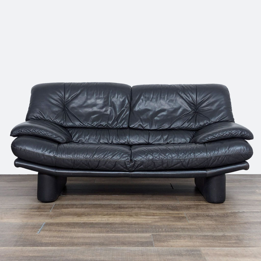 a leather sofa by [ unused0 ], 1970s