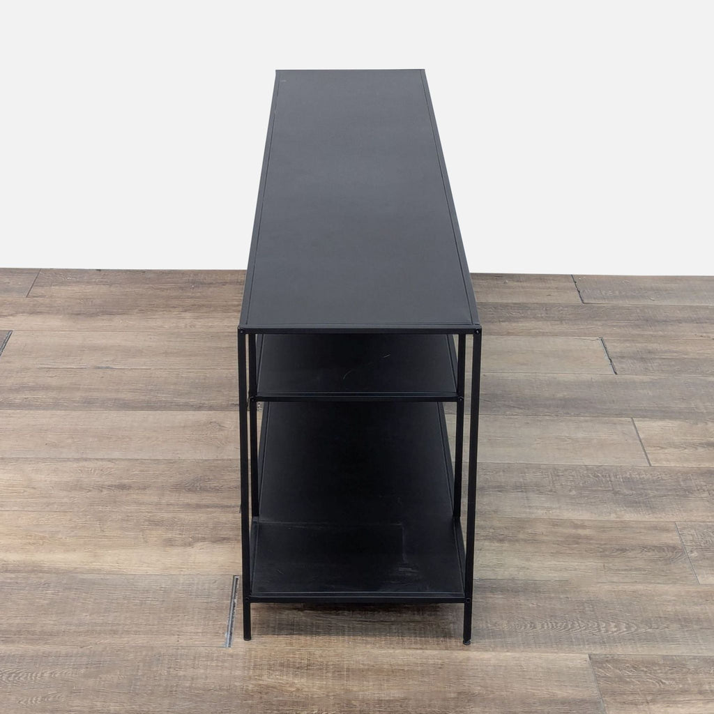 the coffee table is made from a black steel frame.