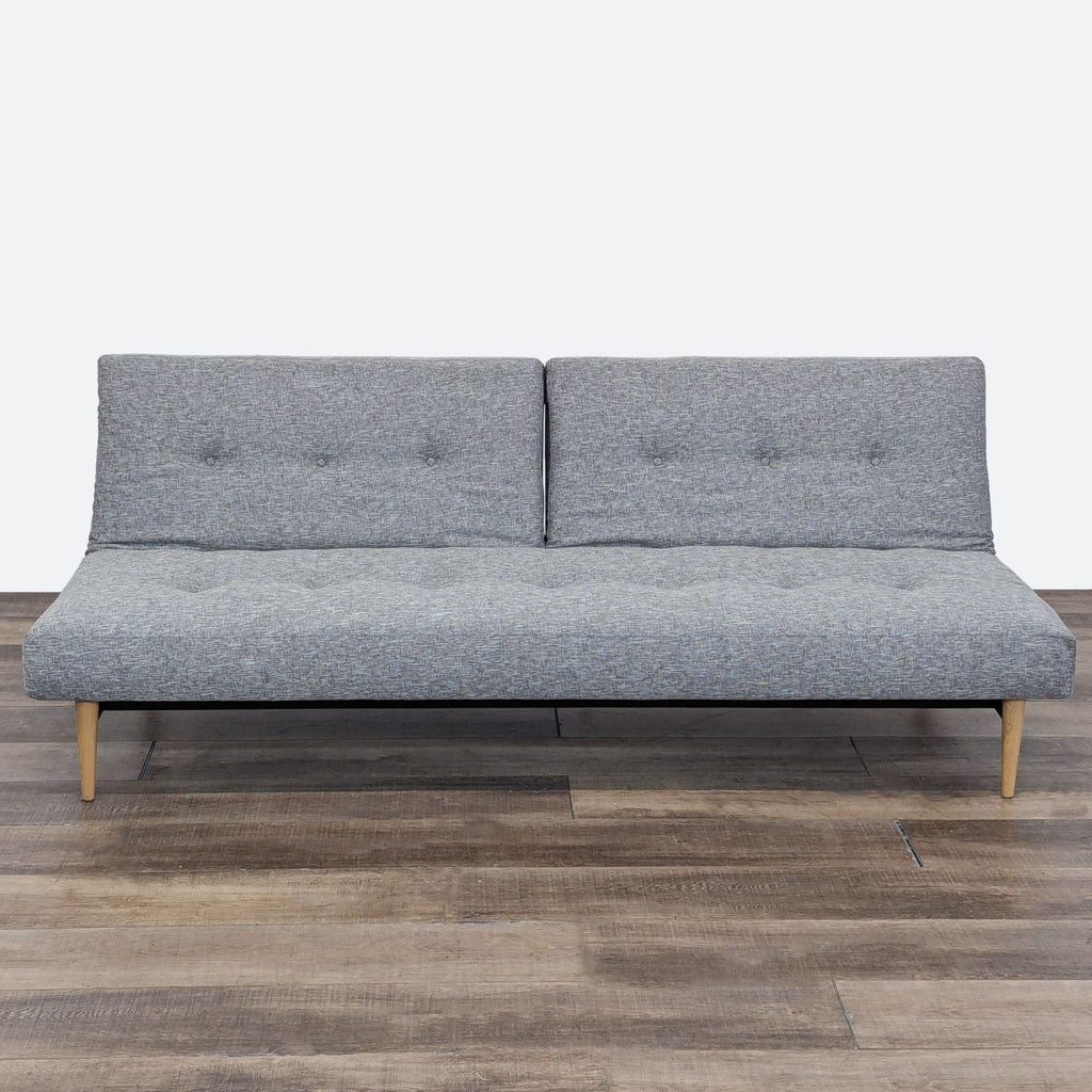 sofa bed in a grey fabric.