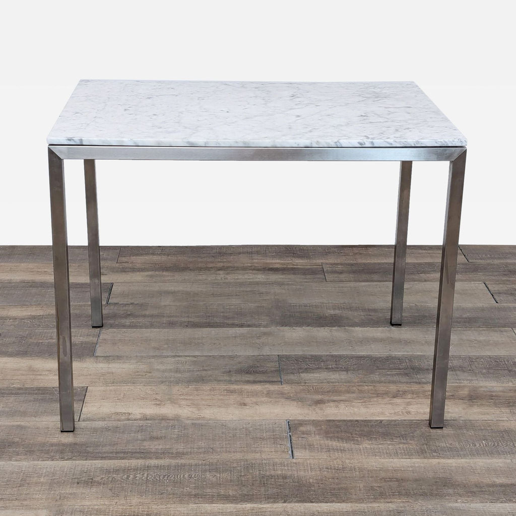 a marble top table with a metal base.