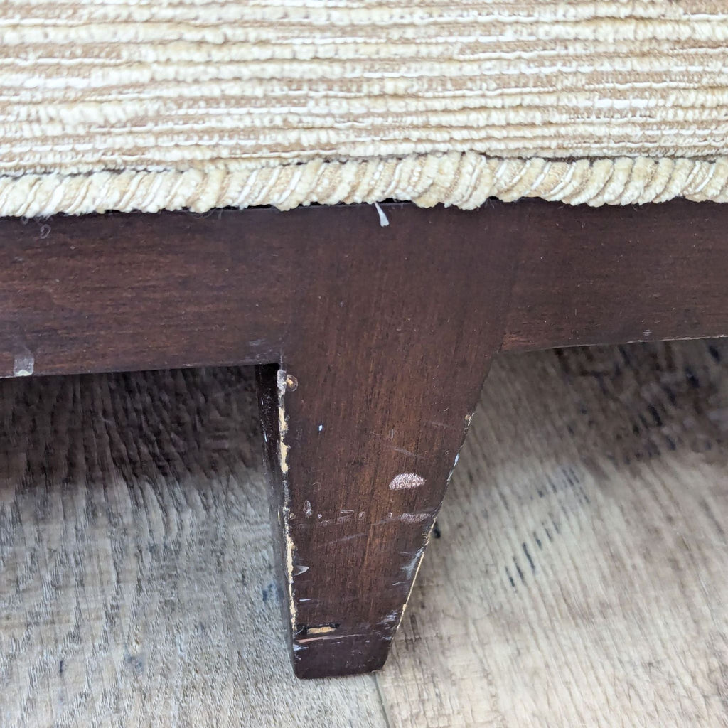 a vintage bench with a woven seat and a stool