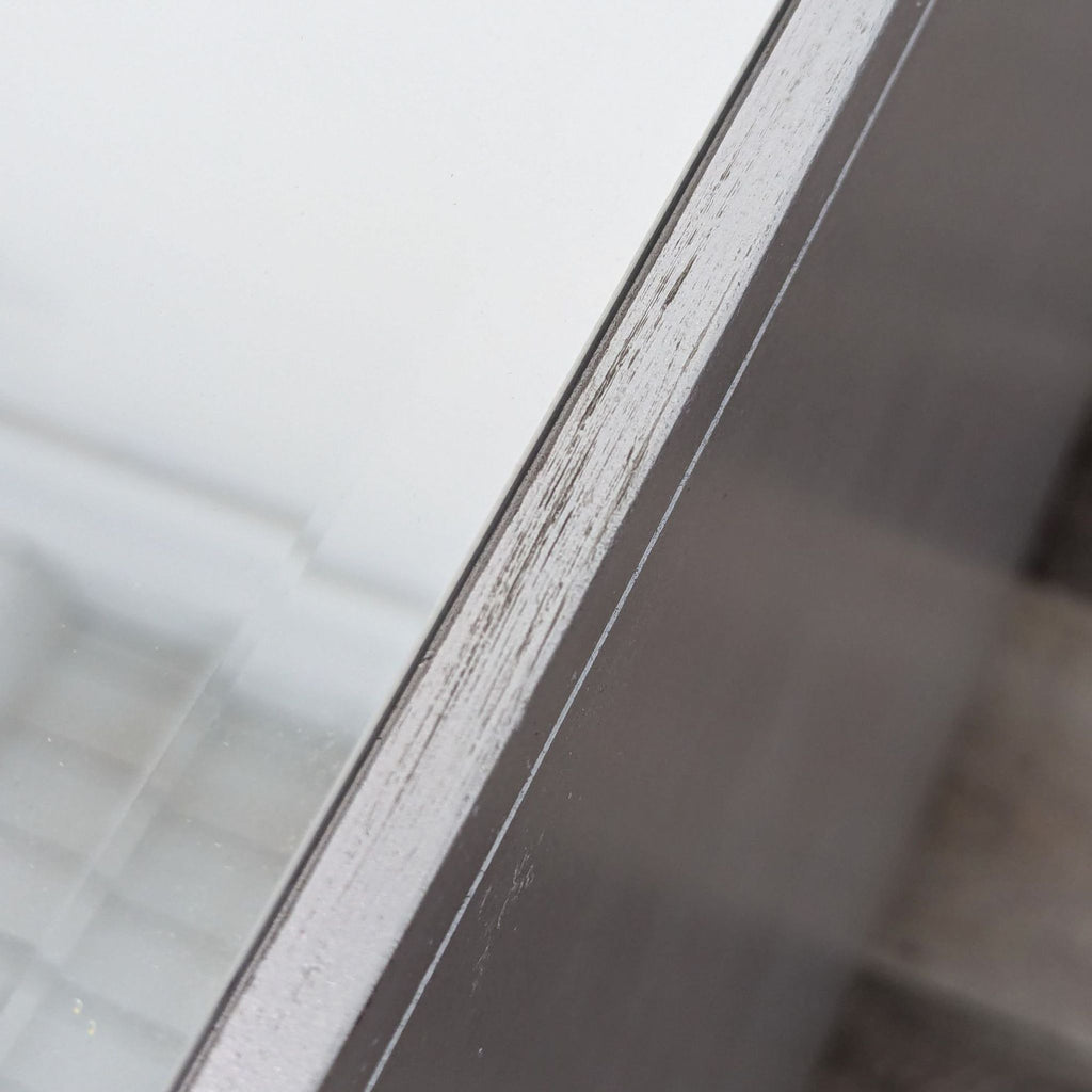 a close up of a window frame with a white paint stain.