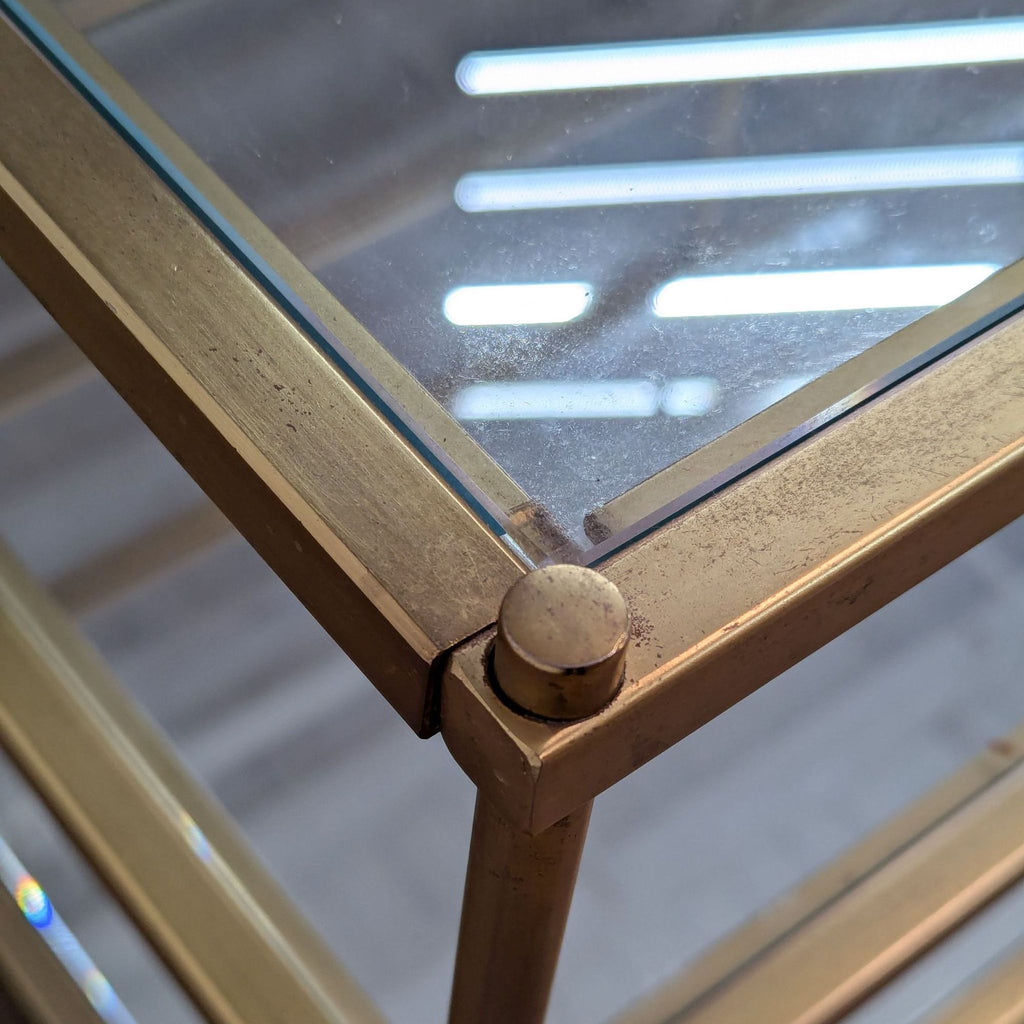 a brass and glass table by [ unused0 ], london, 1970s