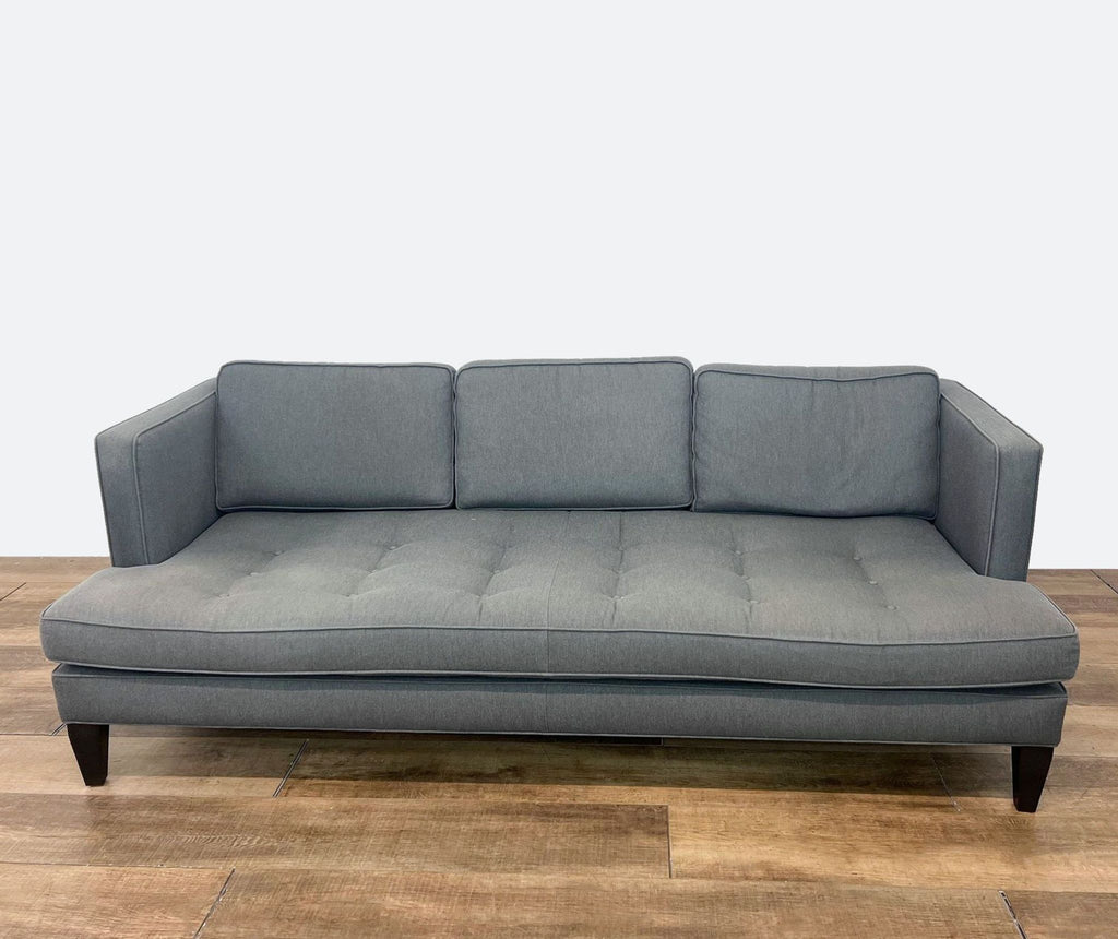 sofa is a modern sofa that is made of soft grey fabric. the sofa is made of a