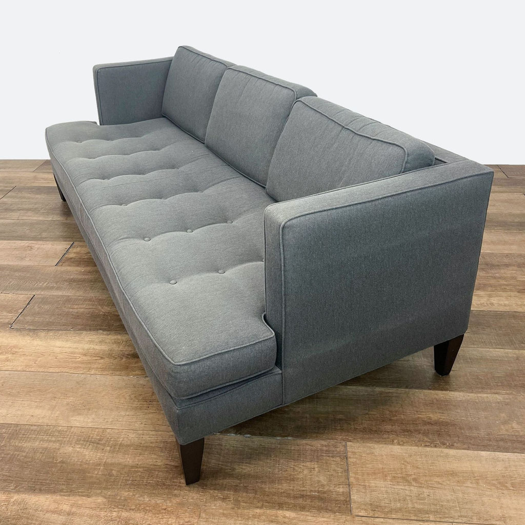 Hutton 87” sofa by Room & Board, three seats, tufted seat, and stylish wood tapered legs.