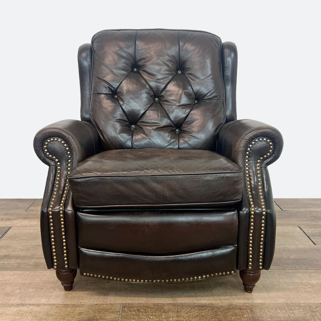 a leather recliner with a brass studs and studs.