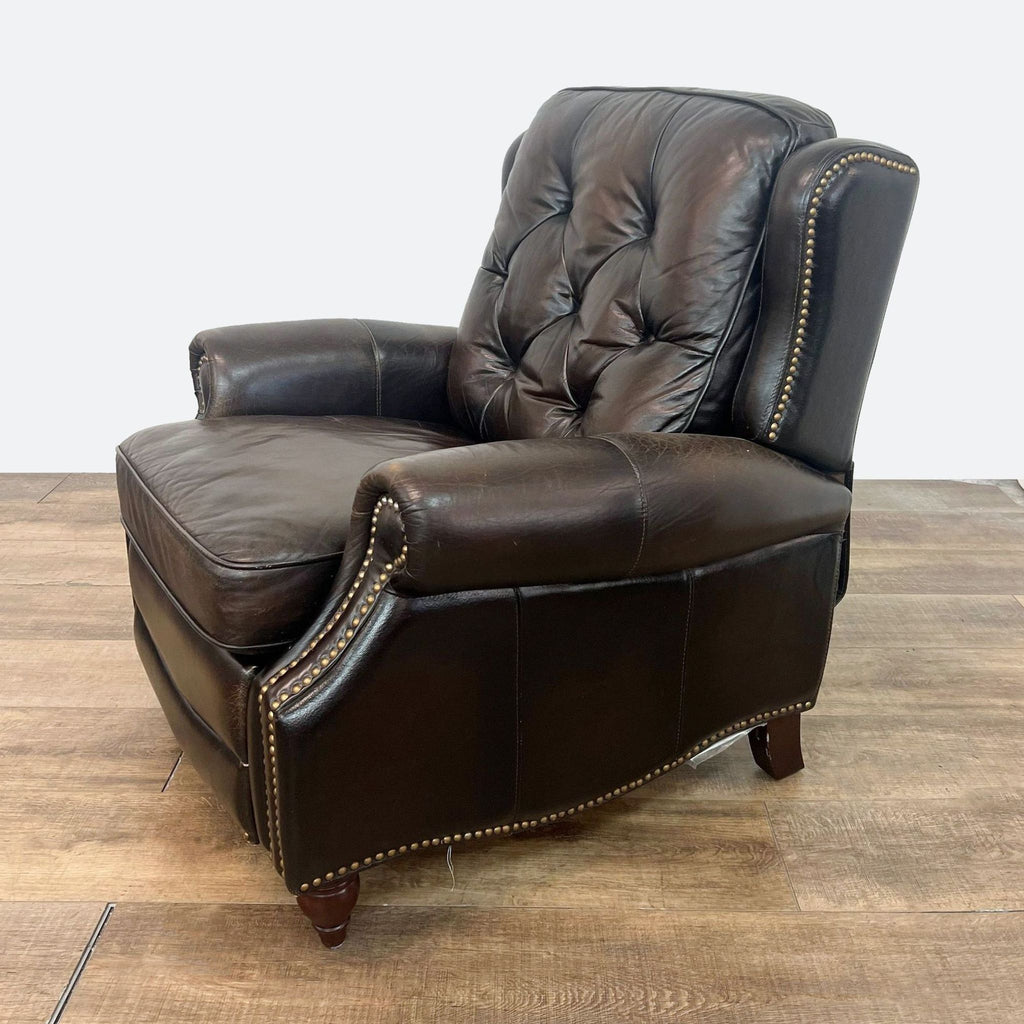 a leather recliner chair with a brown leather frame and a brown leather frame.