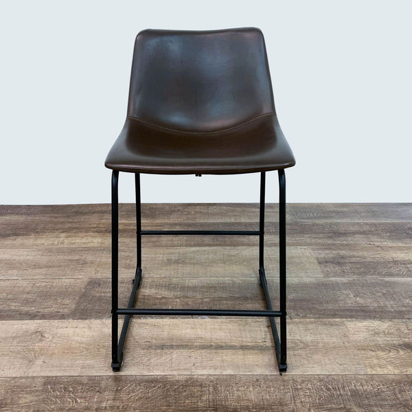 a pair of bar stools by [ unused0 ].