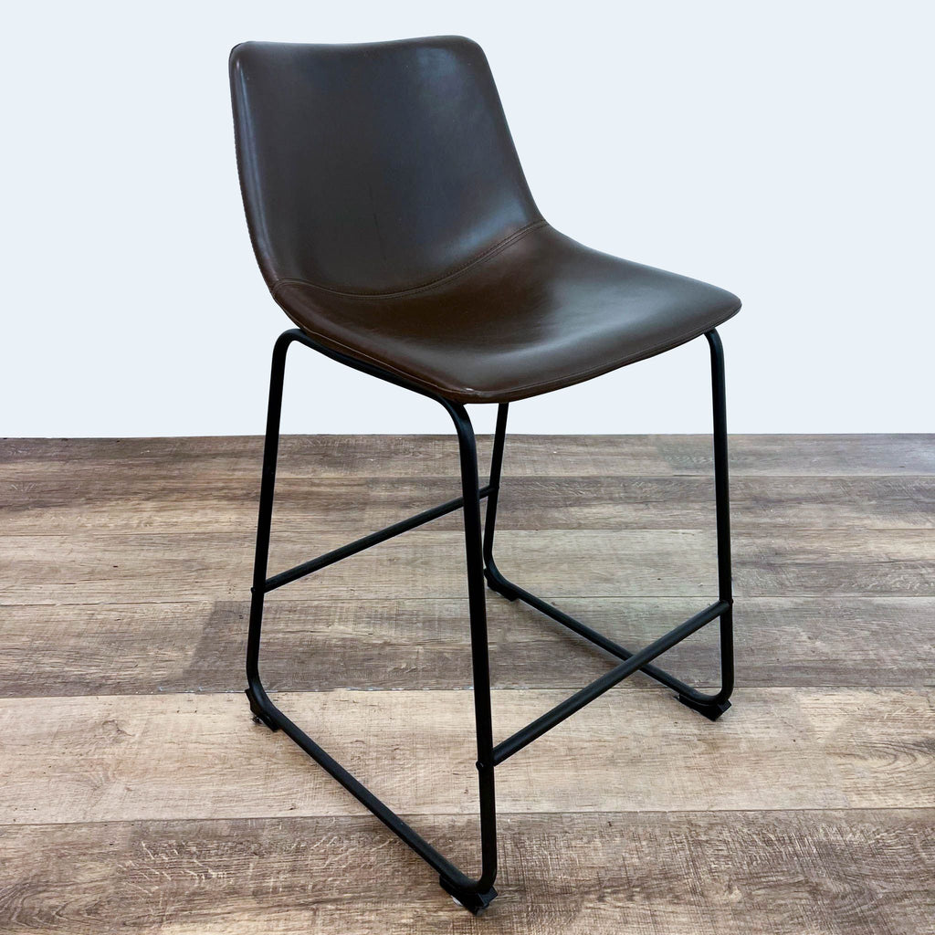 the [ unused0 ] stool is a modern, minimalist design with a black metal frame and