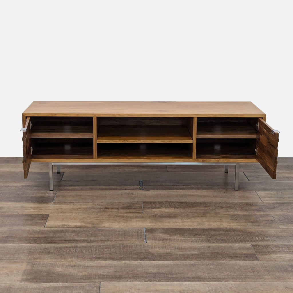 a mid century modern coffee table with a walnut veneered top and a metal shelf.