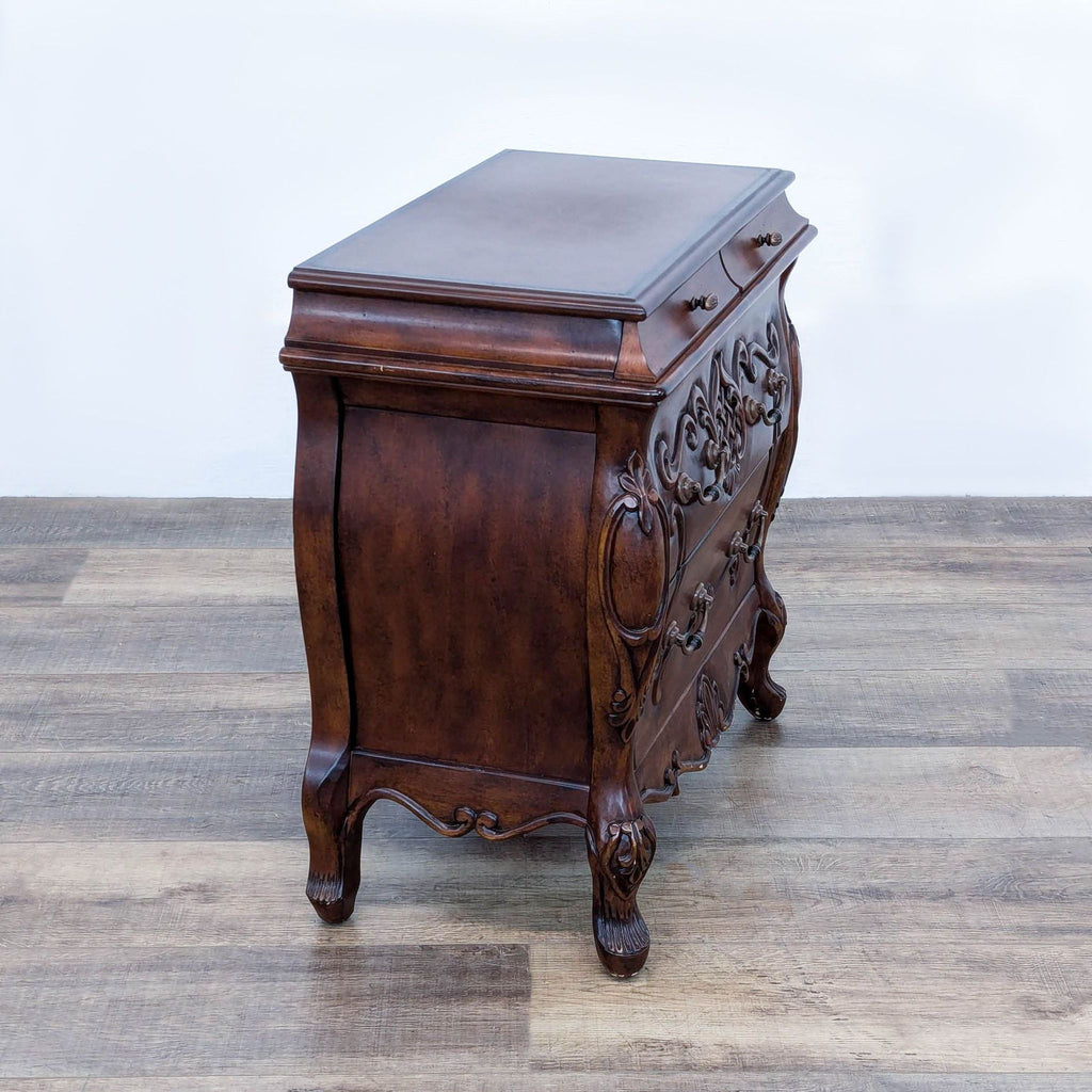 antique french walnut side table with a carved floral motif