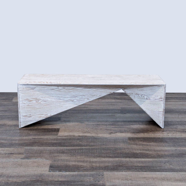 the coffee table is made from a white painted wood plank.