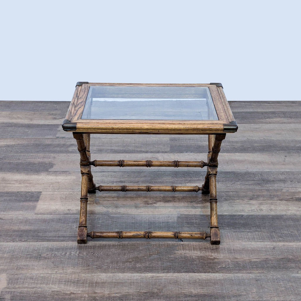 a small table with a glass tray on top.