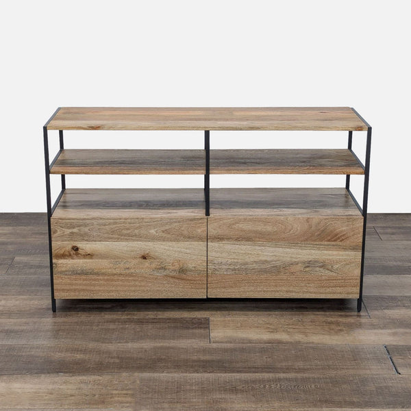 the coffee table is made from reclaimed wood and features a metal frame.