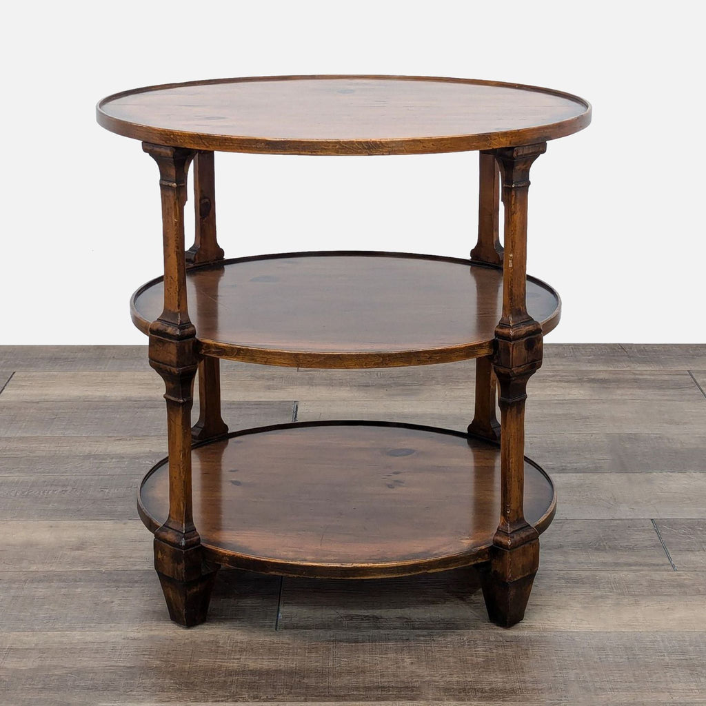 a three tiered round table with three tiers of wood.