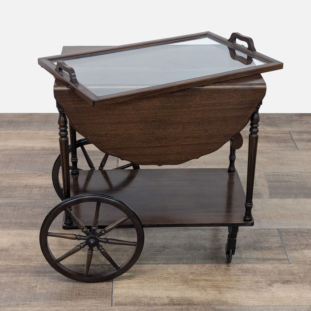 a victorian tea cart with a glass top and a glass top.