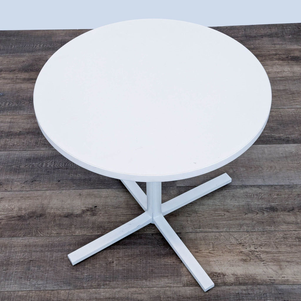 the [ unused0 ] coffee table is a modern, minimalist design with a white base.