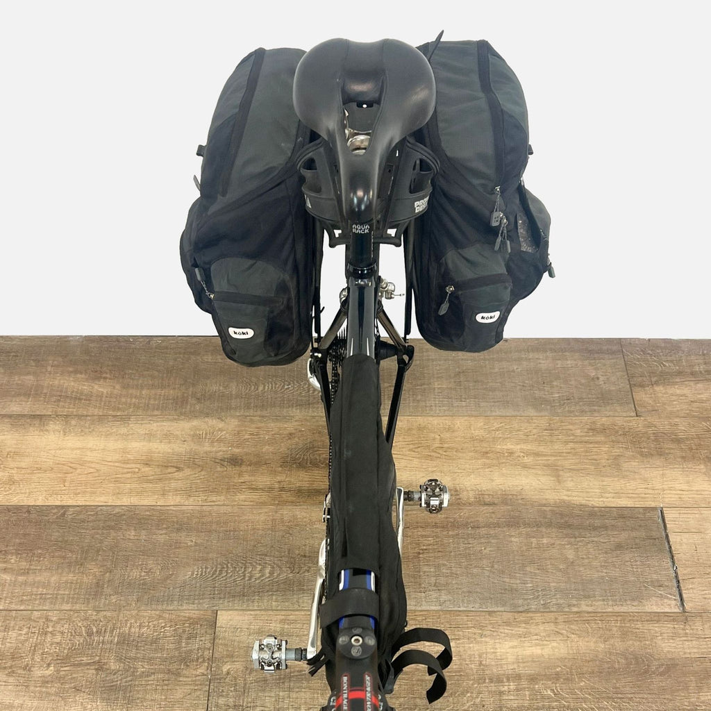 the back of the bike is a backpack that is attached to the back of the bike.