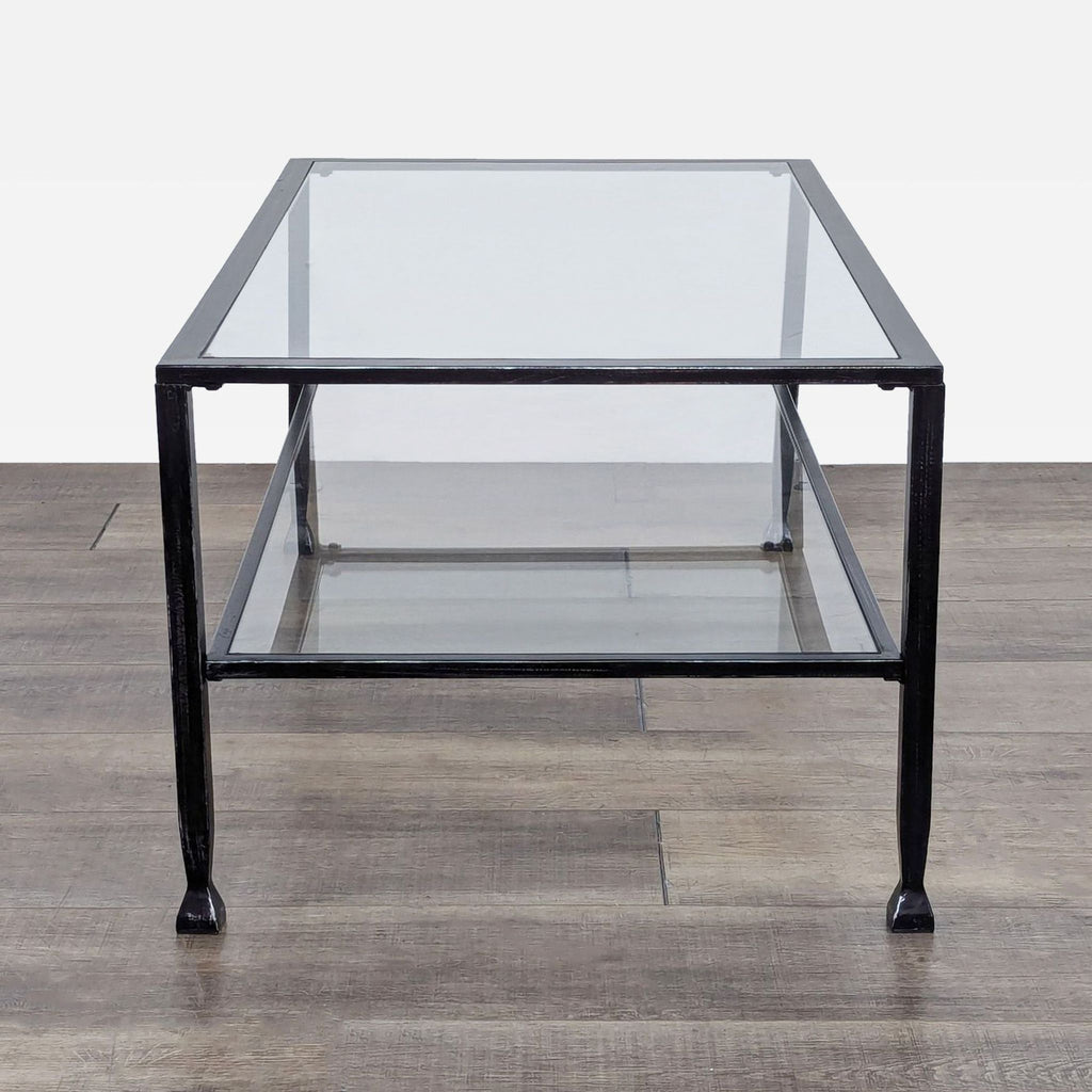 a large industrial style coffee table with glass top.