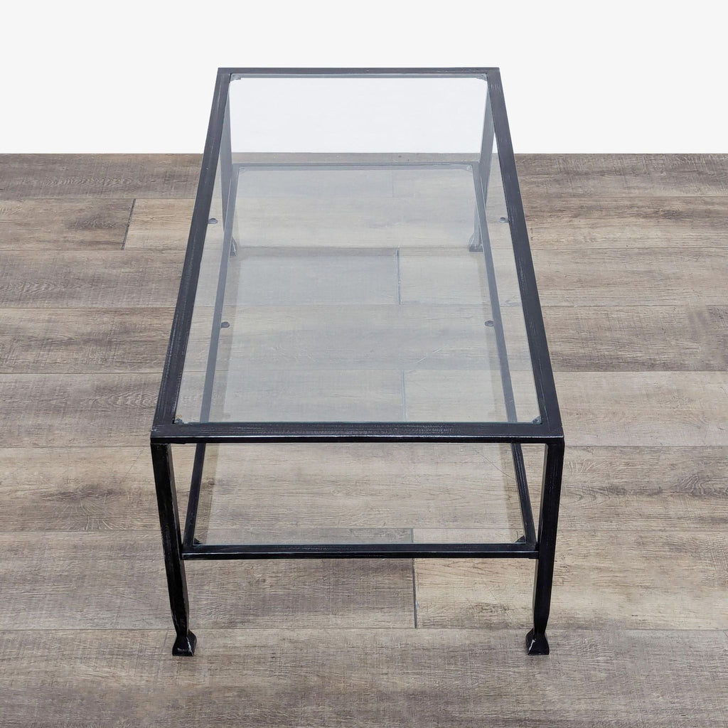 a black glass coffee table with a glass top.