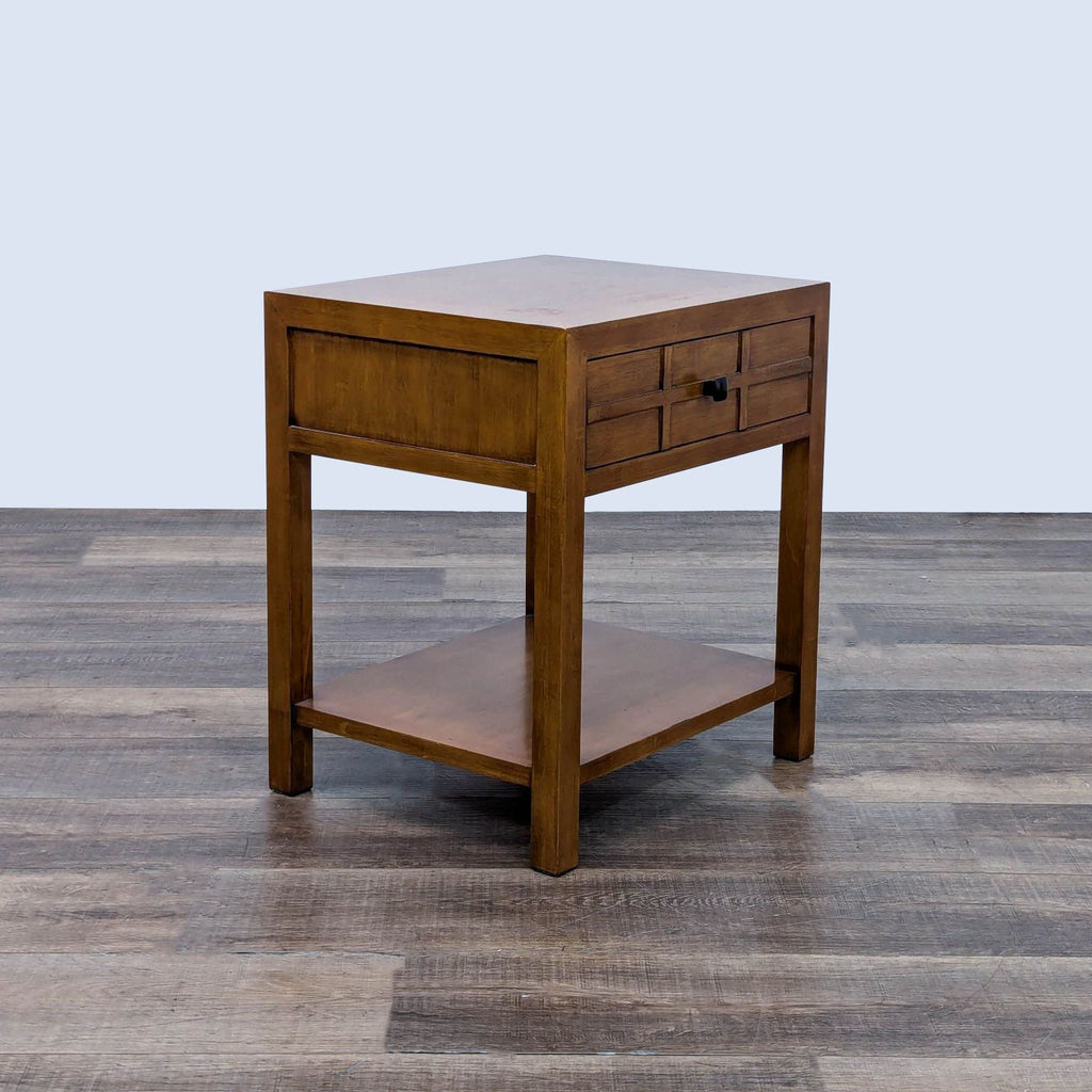 a mid century modern bedside table with a drawer and a shelf.