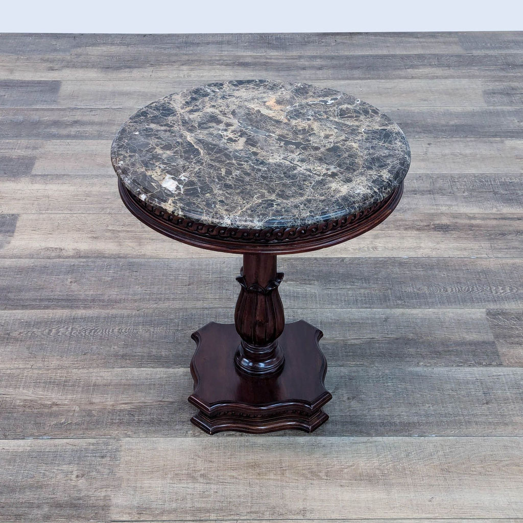 a 19th century carved wood and marble pedestal table