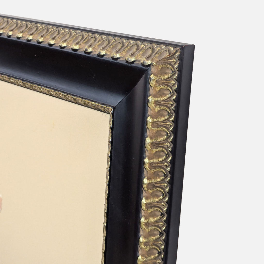 a vintage black and gold framed picture frame